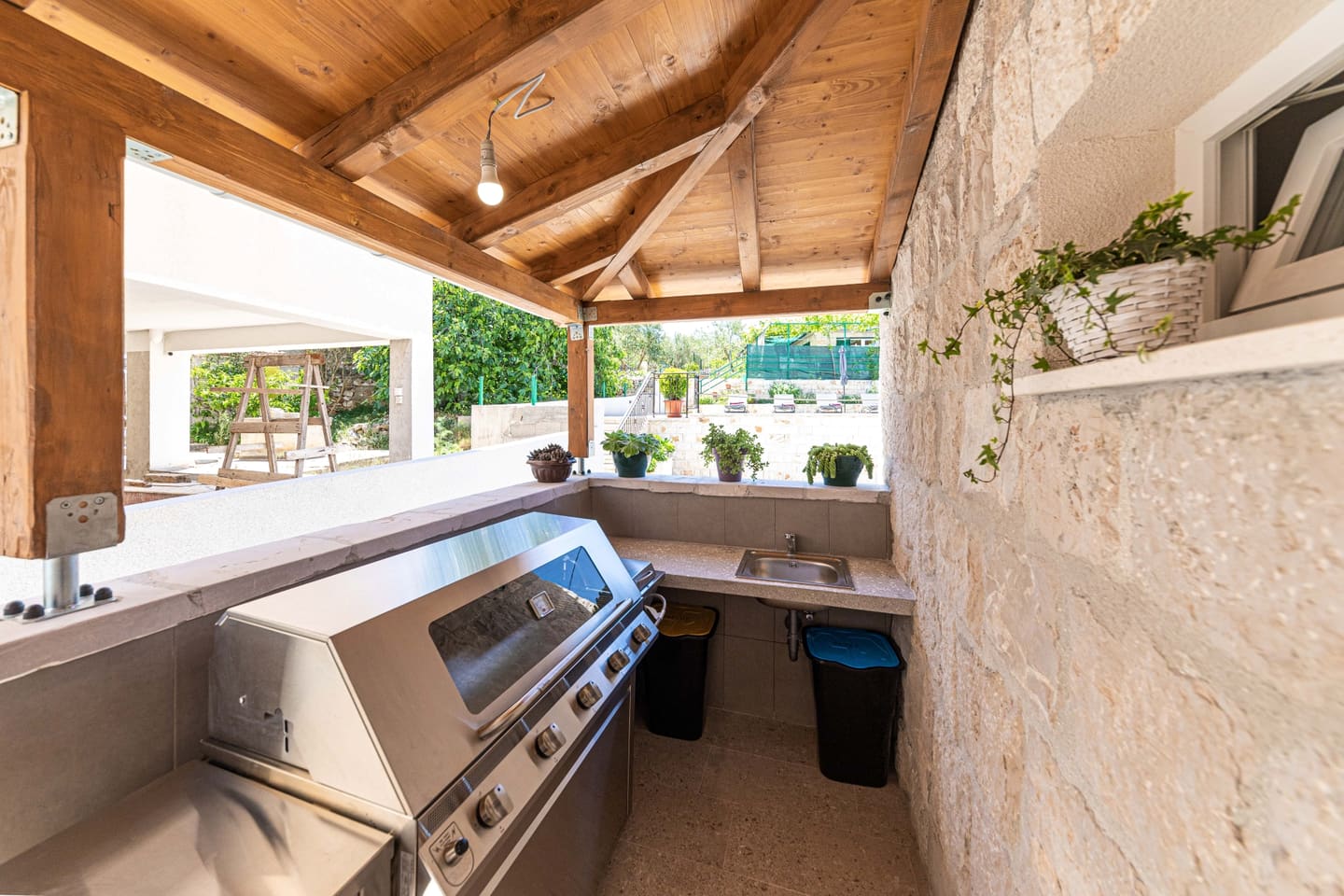 Barbecue area under the stone arch