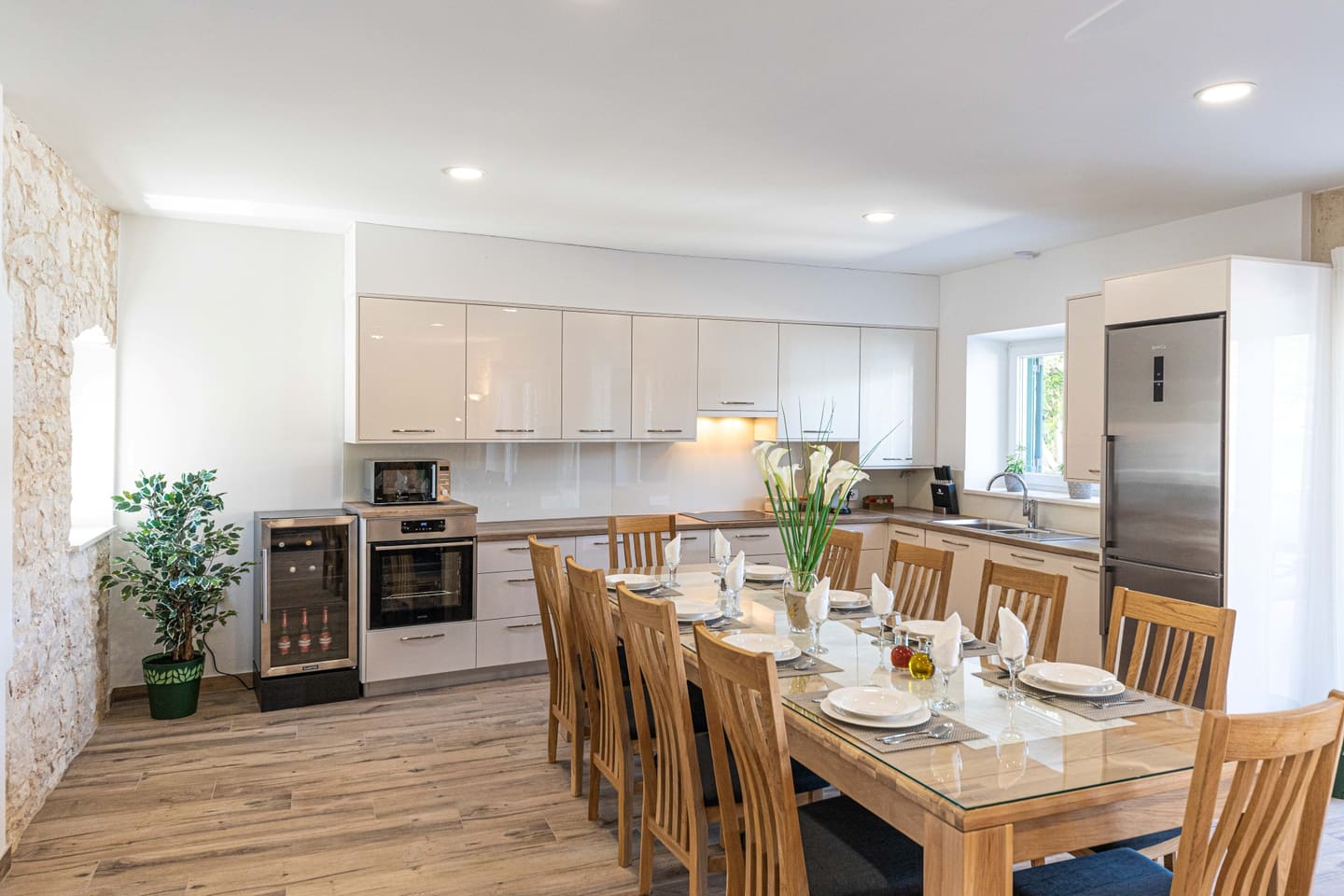 Modern kitchen with dining table for eight
